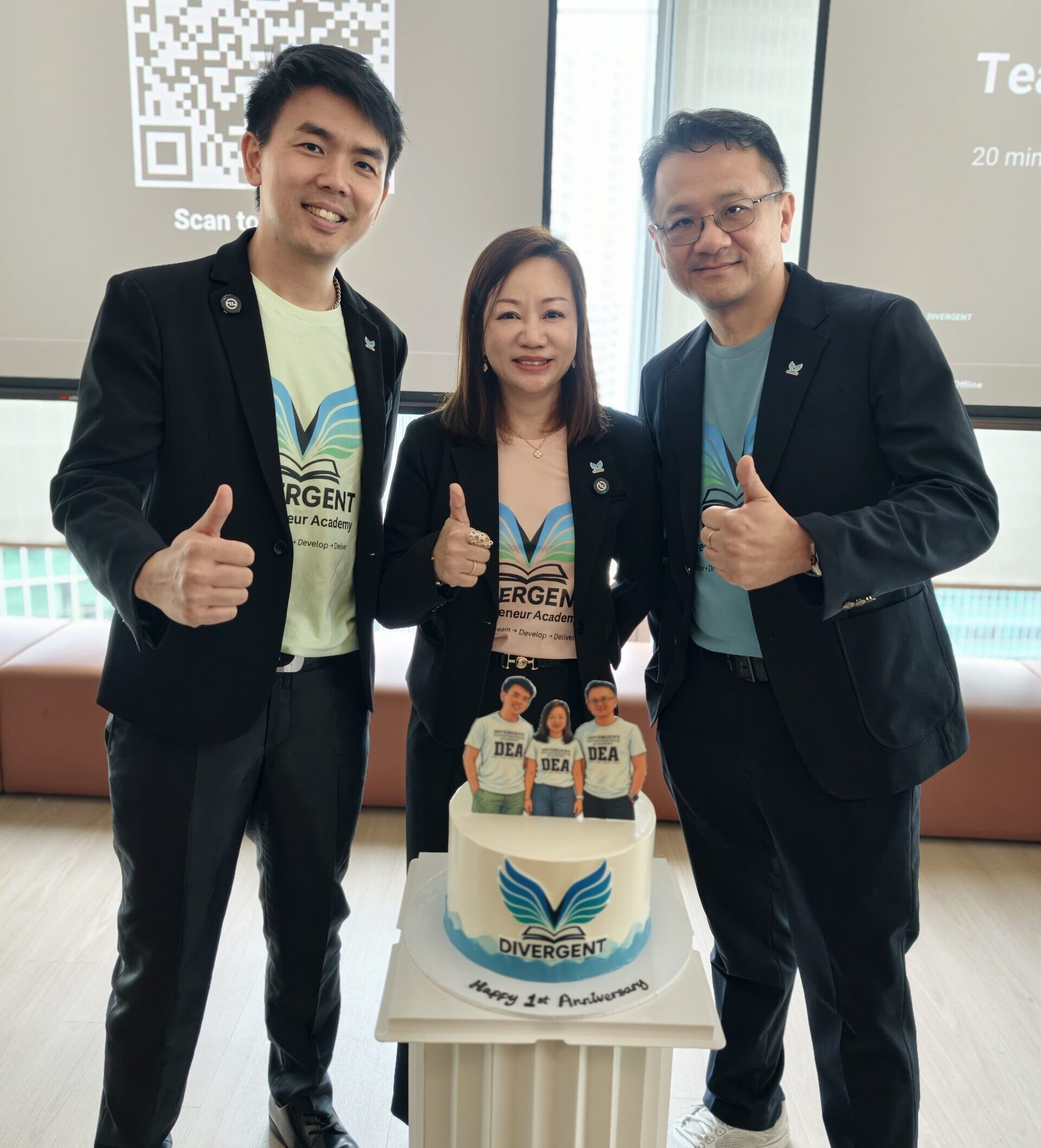 The three Divergent Entrepreneur Academy founders with the first anniversary cake